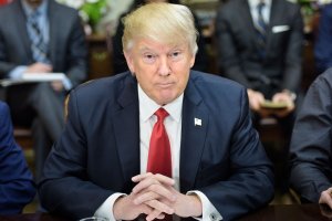 US President Donald Trump waits for a lunch meeting with Harley Davidson executives and union representatives in the Roosevelt Room of the White House February 2, 2017 in Washington, DC. (Credit: BRENDAN SMIALOWSKI/AFP/Getty Images)