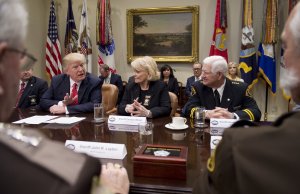 President Donald Trump speaks alongside Sheriff Carolyn Bunny Welsh, center, of Chester County, Pennsylvania, and Sheriff Harold Eavenson, right, of Rockwall County, Texas, during a meeting with county sheriffs in the Roosevelt Room of the White House in Washington, D.C., on Feb. 7, 2017. (Credit: SAUL LOEB/AFP/Getty Images)