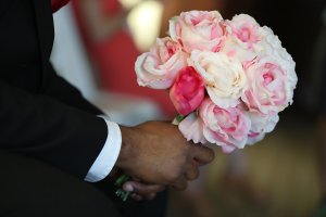 A bouquet of flowers is held in this file photo. (Credit: Joe Raedle/Getty Images)