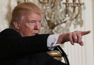 U.S. President Donald Trump calls on a reporter during a news conference announcing Alexander Acosta as the new Labor Secretary nominee in the East Room at the White House on Feb. 17, 2017, in Washington, D.C. (Credit: Mario Tama/Getty Images)