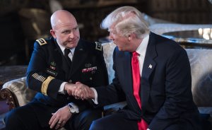 US President Donald Trump shakes hands with U.S. Army Lt. Gen. H.R. McMaster as his national security adviser at his Mar-a-Lago resort in Palm Beach, Florida, on Feb. 20, 2017. (Credit: NICHOLAS KAMM/AFP/Getty Images)