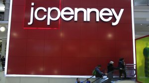 People exit from JCPenny store at Herald Square on November 25, 2016, in New York. (Credit: KENA BETANCUR/AFP/Getty Images) 