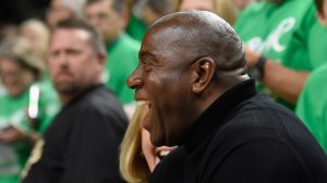 Owner Magic Johnson of the Los Angeles Sparks laughs with a fan before Game Five of the 2016 WNBA Finals against the Minnesota Lynx on Oct. 11, 2016, at Target Center in Minneapolis. (Credit: Hannah Foslien/Getty Images)