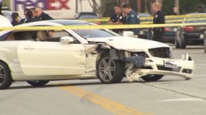 A white Mercedes is shown after it had collided with several other cars following a police pursuit on Feb. 8, 2017. (Credit: KTLA)