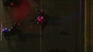 A Manhattan Beach motorcycle officer was involved in a multi-vehicle crash along the 91 Freeway in Cerritos on Feb. 21, 2017. (Credit: KTLA)