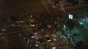 Hundreds of people gathered in Anaheim on Wednesday, Feb. 22, 2017 to protest an off-duty LAPD officer firing his weapon during a struggle with a teen. (Credit: KTLA)