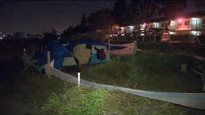 A homeless encampment in the Santa Ana River is shown on Feb. 8, 2017. (Credit: KTLA)