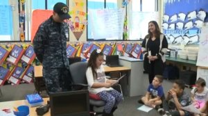 Omar Aleman, a Navy sailor who has been away from his family for over a year returned to San Diego, CA on Feb 1, 2017 and surprised his two daughters at their schools. (Credit: KSWB)