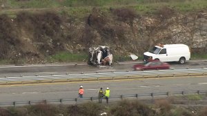 One person died after a crash along the 18 Freeway in the Arrowhead area and officials were searching for a second possible victim on Feb. 18, 2017. (Credit: KTLA) 