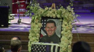 A portrait of Officer Keith Boyer is shown at his funeral March 3, 2017. (Credit: pool)