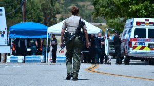 Law enforcement personnel are seen outside a closed-off North Park Elementary School in San Bernardino on April 10, 2017, following a shooting at the school. (Credit: FREDERIC J. BROWN/AFP/Getty Images)