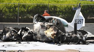 Investigators at the scene of a small plane crash on the southbound 405 Freeway. (Credit: Wally Skalij / Los Angeles Times) 