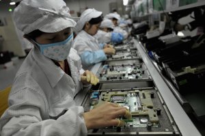 Workers assemble electronics at the Foxconn factory in Shenzhen, China on May 26, 2010. (Credit: AFP/Getty Images)