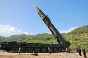 This picture taken and released on July 4, 2017, by North Korea's official Korean Central News Agency (KCNA) shows North Korean leader Kim Jong-Un, second from right, inspecting the test-fire of the intercontinental ballistic missile Hwasong-14 at an undisclosed location. (Credit:  AFP PHOTO / KCNA VIA KNS / STR / South Korea)