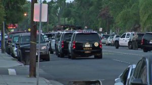 Authorities respond to a barricaded man in Bellflower on Aug. 17, 2017. (Credit: KTLA)