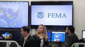 FEMA employees are seen at the agency's Washington, D.C. headquarters shortly before a visit from President Donald Trump on Aug. 4, 2017. (Credit: Michael Reynolds/ Pool/Getty Images)