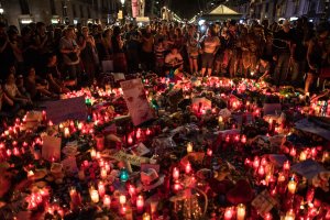 Hundreds gather on Aug. 18, 2017, around tributes laid near the scene of the Barcelona terror attack that left at least 13 dead. (Credit: Carl Court/Getty Images)