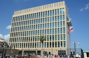 View of the U.S. Embassy building with the US flag raised over it in Havana on August 14, 2015. (Credit: STR/AFP/Getty Images)