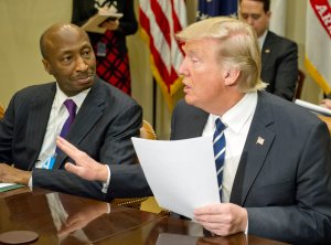 President Donald Trump and Merck CEO Kenneth C. Frazier sat next to each when the president met with representatives of the Pharmaceutical Research and Manufacturers of America in the Roosevelt Room of the White House on Jan. 31, 2017 in Washington, DC. (Credit: Ron Sachs - Pool/Getty Images)