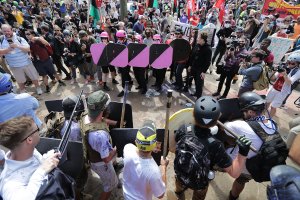 Battle lines form between white nationalists, neo-Nazis and members of the "alt-right" and anti-fascist counter-protesters at the entrance to Emancipation Park during the "Unite the Right" rally Aug. 12, 2017, in Charlottesville, Virginia. (Credit: Chip Somodevilla / Getty Images)