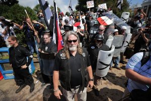 White nationalists, neo-Nazis and members of the "alt-right" exchange insluts with counter-protesters as they attempt to guard the entrance to Emancipation Park during the "Unite the Right" rally Aug. 12, 2017, in Charlottesville, Virginia. (Credit: Chip Somodevilla / Getty Images)