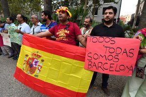 Members of the Pakistani community living in Barcelona gather on the La Rambla del Rabal in Barcelona against the attacks and in tribute to the victims of the Barcelona attack on Aug. 19, 2017, two days after a van ploughed into the crowd, killing 13 persons and injuring over 100. (Credit: Pascal Guyot / AFP / Getty Images)