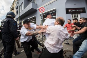 Participants of a Neo-Nazi march clash with counter demonstrators as German police try to break between the sides, on Aug. 19, 2017, in Berlin. (Credit: Omer Messinger / Getty Images)