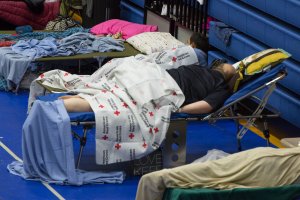 Evacuees from Hurricane Harvey take shelter at the Delco Center in east Austin, Texas on Aug. 27, 2017. (Credit: Suzanne Cordeiro / AFP / Getty Images)