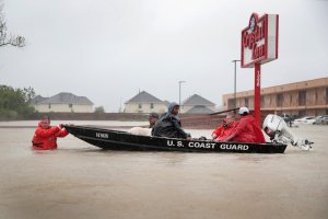 People are rescued from a flooded neighborhood after it was inundated with rain water, remnants of Hurricane Harvey, on Aug. 28, 2017, in Houston, Texas. (Credit: Scott Olson / Getty Images)