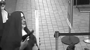 A surveillance image provided by WNEP shows two would-be bank robbers dressed as nuns in Pennsylvania.