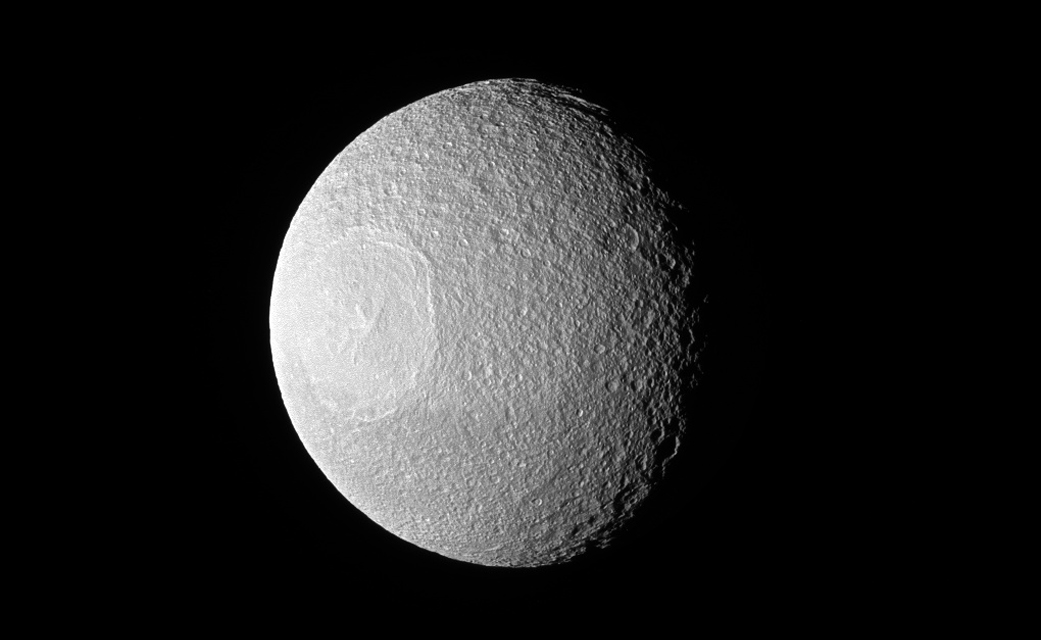 Tethys, one of Saturn's larger icy moons, vaguely resembles an eyeball staring off into space in this view from NASA's Cassini spacecraft. If you ask “Star Wars” fans, they will tell you how strangely similar it looks to the Death Star. (Credit: NASA)