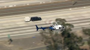 A CHP helicopter hovers over a pursuit suspect along the 210 Freeway in Pasadena on Sept. 18, 2017. (Credit: KTLA)