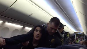 A passenger is removed from a Southwest Airlines flight on Sept. 27, 2017. (Credit: Bill Dumas)