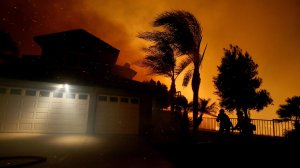 Crews battle the Canyon fire as it closes in on homes in Corona on Sept. 25, 2017. (Credit: Luis Sinco)