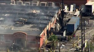 The entire roof of Universal Iron Doors and Hardware in Sun Valley can be seen scorched off after a fire on Sept. 25, 2017. (Credit: KTLA)