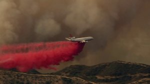 An aircraft drops fire retardant on the Canyon Fire on Sept. 25, 2017. (Credit: KLTA)