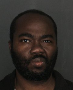 Christopher Tanpinu Agbaosi is seen in a booking photo released by Fontana police. 