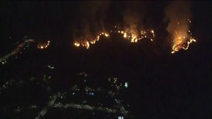 The La Tuna fire burns near homes on Sept. 2, 2017. (Credit: Sky5 / KTLA)