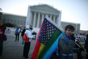Justin Kenny of Akron Ohio holds a modified Stars and Stripes flag in front of the U.S. Supreme Court, on March 26, 2013, in Washington, DC. (Credit: Mark Wilson / Getty Images)