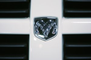 The logo for Dodge Ram can be seen on the grill of a truck. (Credit: ROBERTO SCHMIDT/AFP/Getty Images)