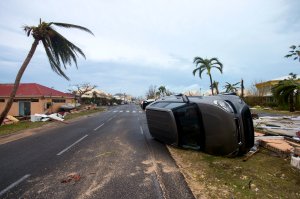 A car turned onto its side in Marigot, near the Bay of Nettle, on the French Collectivity of Saint Martin, after the passage of Hurricane Irma on Sept.6, 2010. (Credit: LIONEL CHAMOISEAU/AFP/Getty Images)