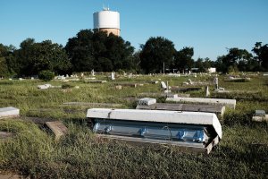 A casket, uprooted by the floods, sits in a cemetery in Orange as Texas slowly moves toward recovery from the devastation of Hurricane Harvey on Sept. 7, 2017, in Orange, Texas. (Credit: Spencer Platt / Getty Images)