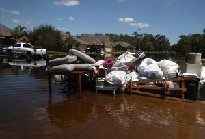 Damaged furniture and personal belongings sit in front of a flooded home on Sept. 7, 2017, in Richwood, Texas. (Credit: Justin Sullivan / Getty Images)