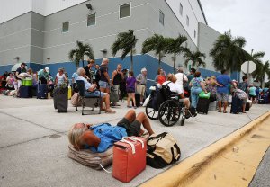 People wait in line to enter the Germain Arena in Estero, Florida, which is serving as a shelter from Hurricane Irma, on Sept. 9, 2017. (Credit: Mark Wilson/Getty Images)