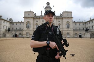 An armed police officer stands guard outside the Horse Guards Parade in central London on Sept. 16, 2017. (Credit: Chris J. Ratcliffe / AFP / Getty Images)