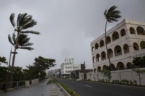 Empty businesses stand along Avenida Munoz Rivera as residents prepare for a direct hit from Hurricane Maria on Sept. 19, 2017, in San Juan, Puerto Rico. (Credit: Alex Wroblewski / Getty Images)