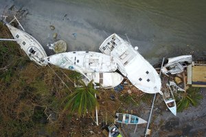 Damaged sail boats washed ashore are seen in the aftermath of Hurricane Maria in Fajardo, Puerto Rico, Sept. 21, 2017. (Credit: Ricardo Arduengo / AFP / Getty Images)