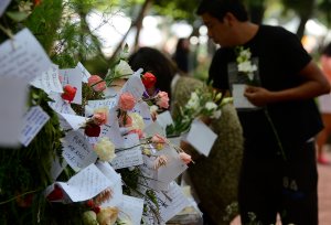 People start a memorial with flowers at a park in front of one of the collapsed buildings in Mexico city on Sept. 23, 2017.(Credit: Luis Perez / AFP / Getty Images)