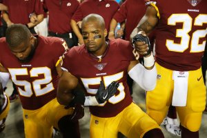 Outside linebacker Ryan Anderson and linebacker Chris Carter of the Washington Redskins during the the national anthem on Sept. 24, 2017. (Credit: Patrick Smith / Getty Images)