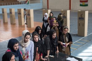 Women are seen waiting in line to cast their referendum vote at a voting station on Sept. 25, 2017, in Erbil, Iraq. (Credit: Chris McGrath / Getty Images)
